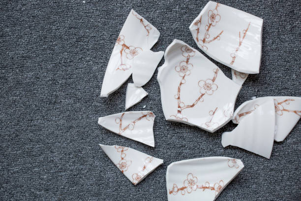 istock Japanese style bowl broken into pieces on the floor. 695031450