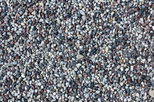 istock Small gray stones on a ground. 695031524