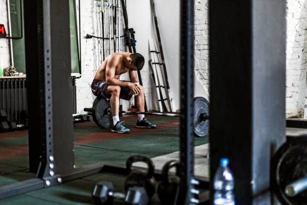 istock Man taking break In Gym 695037760