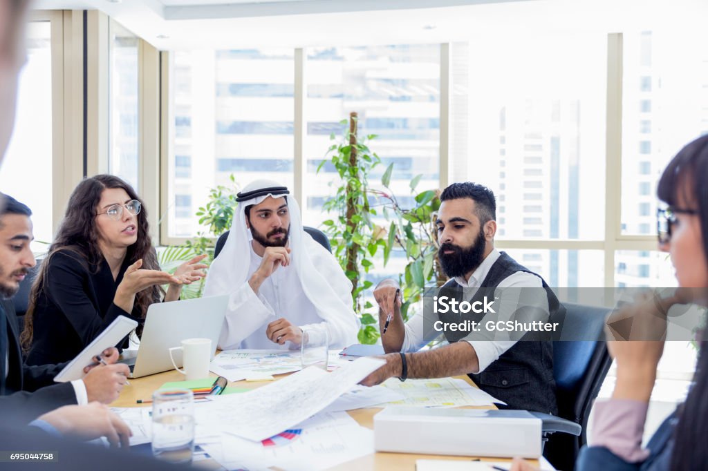 Arab business executive chairing an important business meeting Corporate Business In The Middle East Arabia Stock Photo