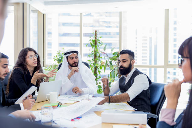 Arab business executive chairing an important business meeting Corporate Business In The Middle East arab culture stock pictures, royalty-free photos & images
