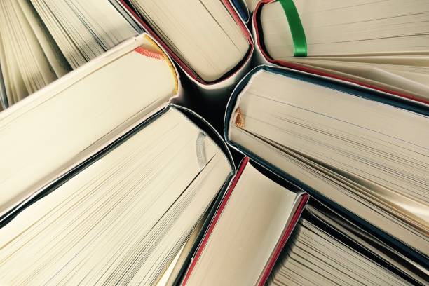 istock Hardcover books pile seen from above 695045068