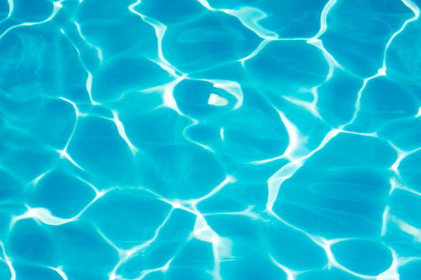 istock Crystal clear blue water in swimming pool water 695048428