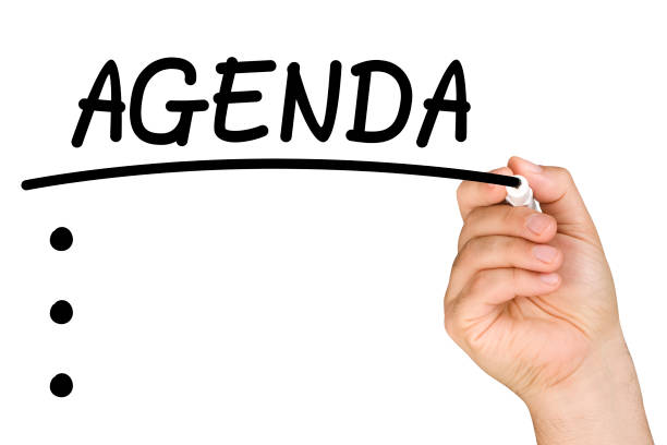 istock hand underlining agenda text with black felt tip or marker on a clear glass whiteboard isolated 695048432