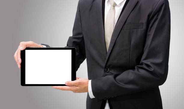 istock Businessman standing posture hand holding blank tablet 695054996