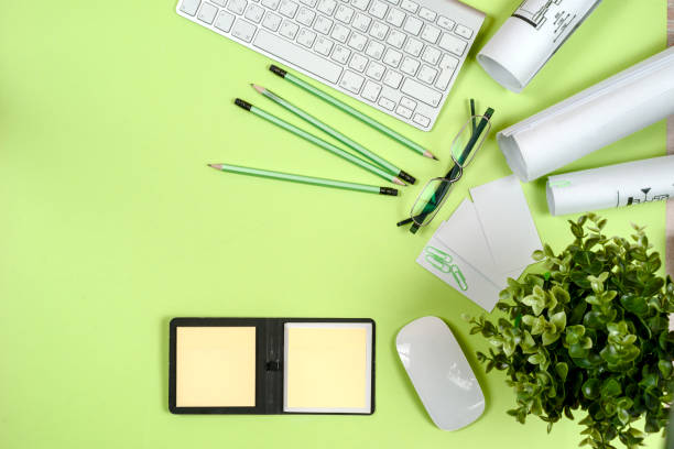 istock Office black desk table with white computer, supplies. 695055288