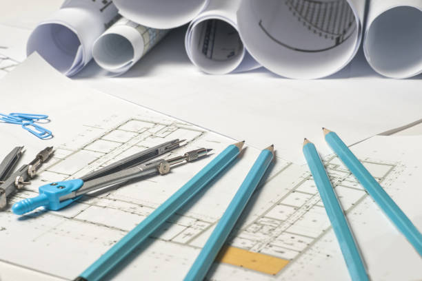 istock Workplace of architect - rolls and plans. 695058710