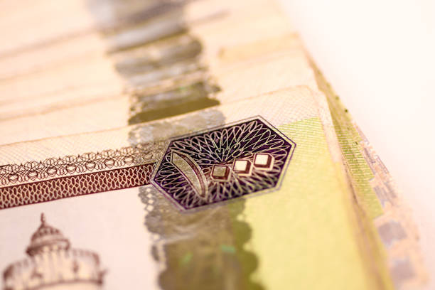 istock Close up Dirhams currency note and coins, AED, United Arab Emirates 695059032
