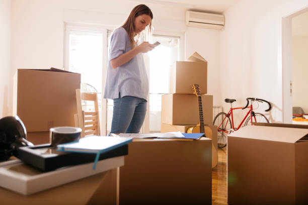 istock Woman standing in new home 695059730