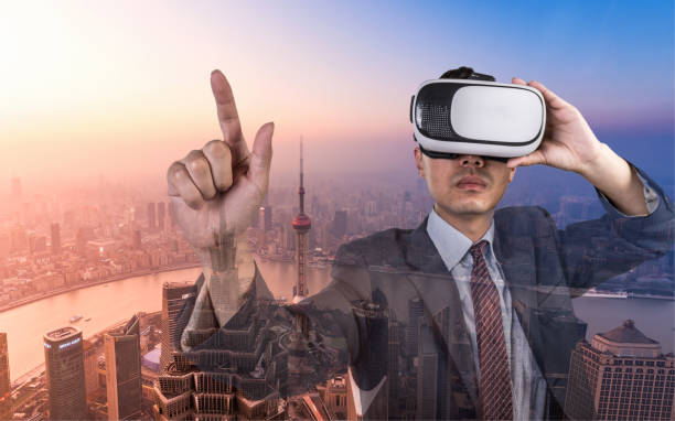 istock Young asian businessman wearing virtual reality 695059830