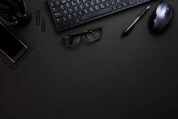 istock Computer Keyboard And Mouse With Office Supplies On Gray Desk 695062482