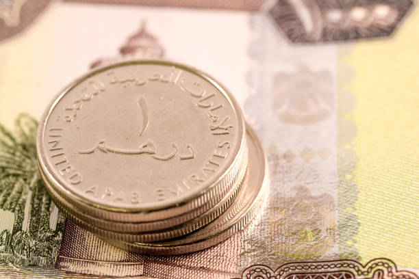 istock Close up Dirhams currency note and coins, AED, United Arab Emirates 695065436