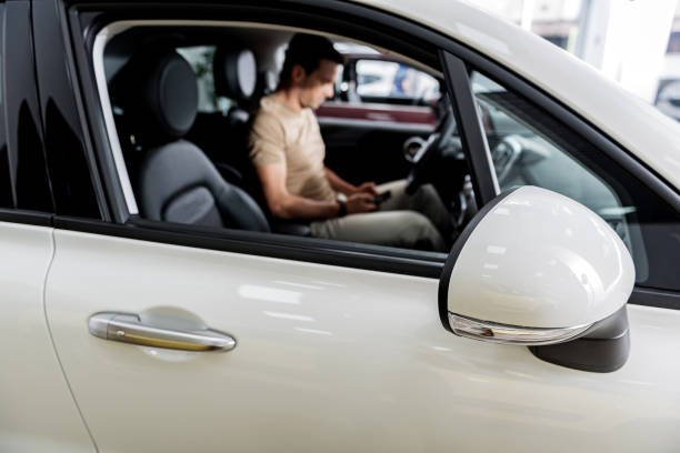 istock Man locating in new automobile 695065580