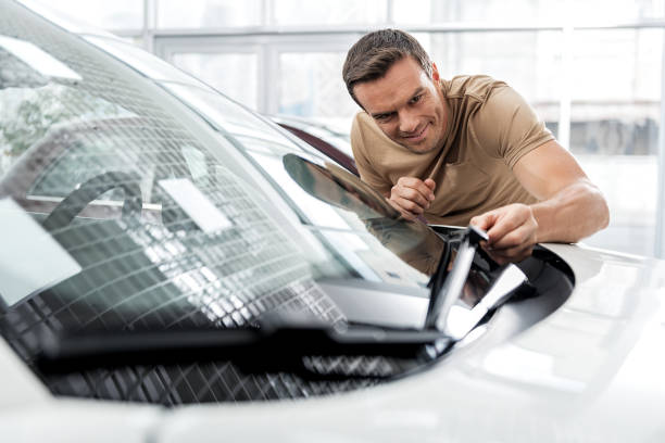 istock Outgoing man standing near automobile 695065622