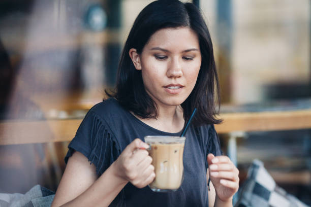 istock Hipster Woman Drinking Iced Coffee 695068512