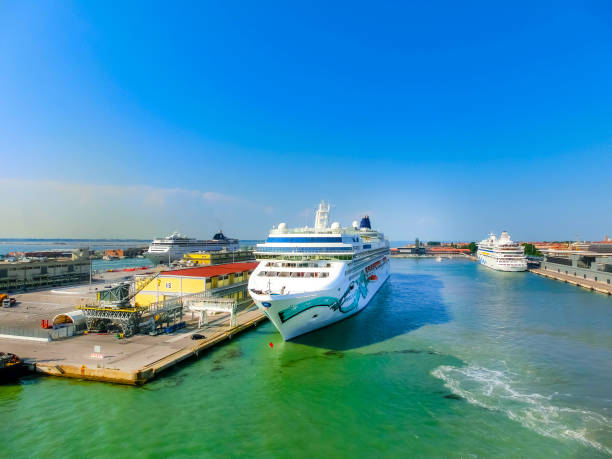 Venice, Italy - June 06, 2015: Cruise Ship Norwegian Jade by NCL docked at the port of Venice, Italy on a background of the roofs on June 06, 2015