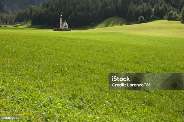 St Johann Little Church Among A Wide Green Meadow In St Magdalena Val Di Funes Stock Photo - Download Image Now