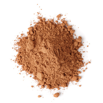 Heap of organic cocoa powder isolated on white background
