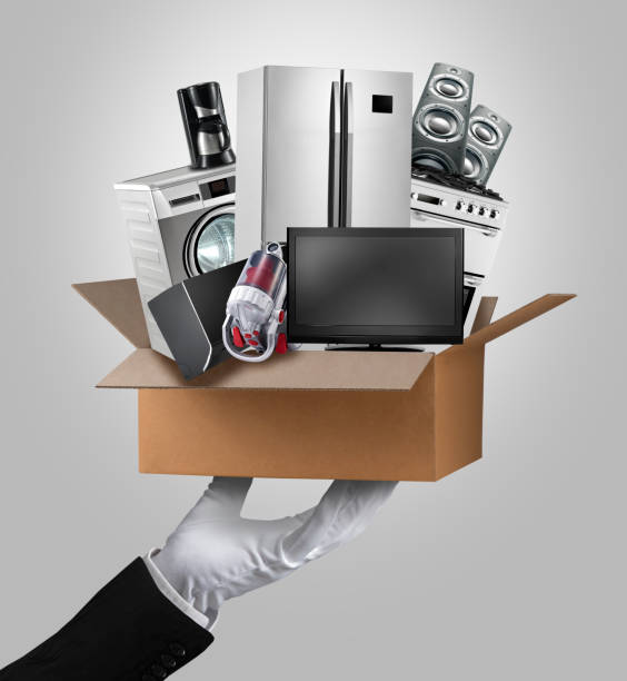 istock waiter serving a box of appliances(with vacuum cleaner) 695081414