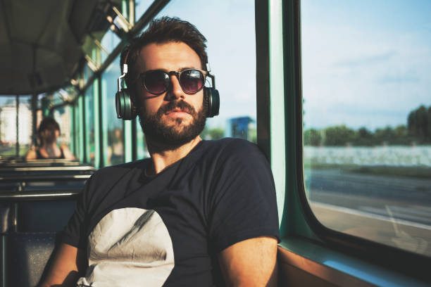 istock Young man riding in public transport 695081724