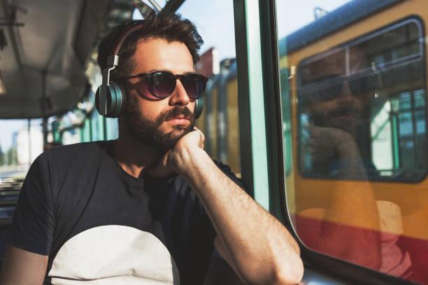 istock Young man riding in public transport 695081726