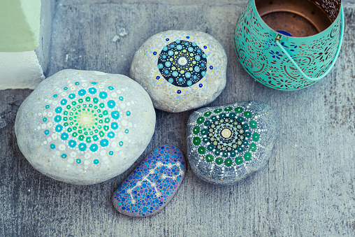 different hand painted stones for decoration