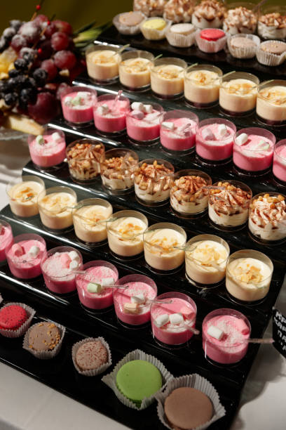 istock Desserts in glasses on catering table 695088668