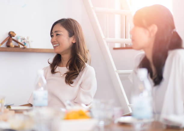 istock Female friends having lunch and chat at home 695093906