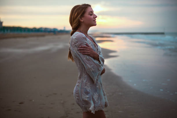 istock Dreamy girl  on beach 695097134