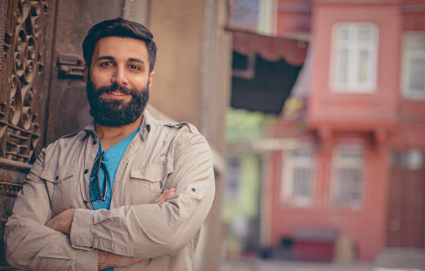 istock Happy young man with long beard enjoying outdoor 695107916