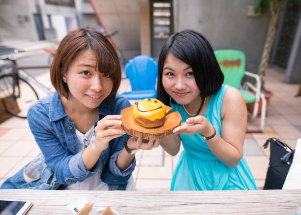 istock Smiling girls and doughnut 695108084