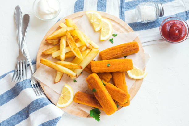 istock Fried Fish Sticks with French Fries 695116612