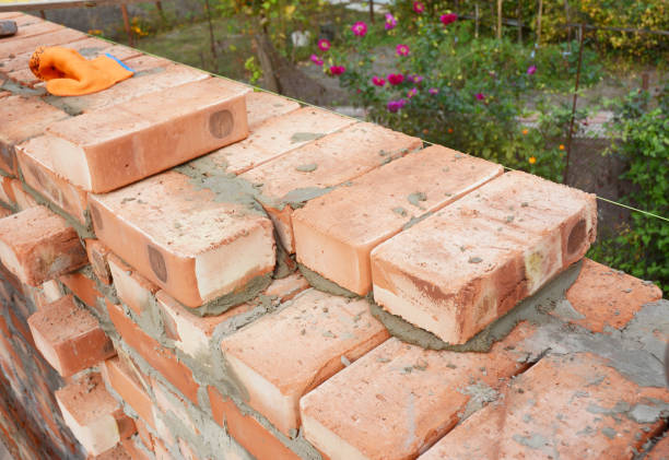 istock Bricklaying, Brickwork. Bricklaying on House Construction Site. Building Home wall from Bricks 695116660