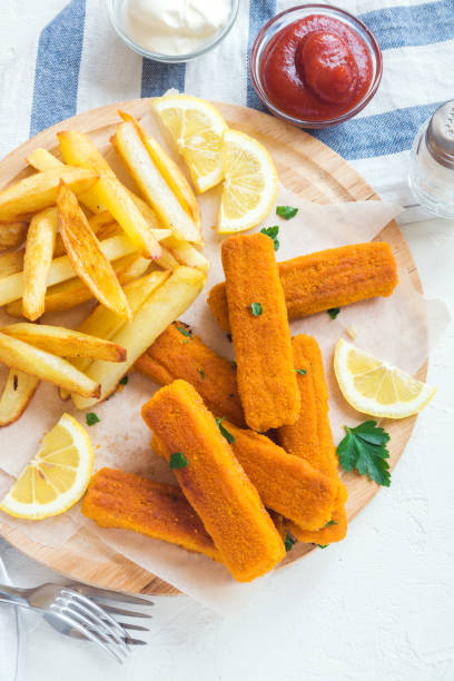 istock Fried Fish Sticks with French Fries 695116974