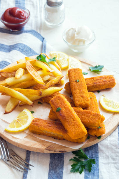 istock Fried Fish Sticks with French Fries 695117294