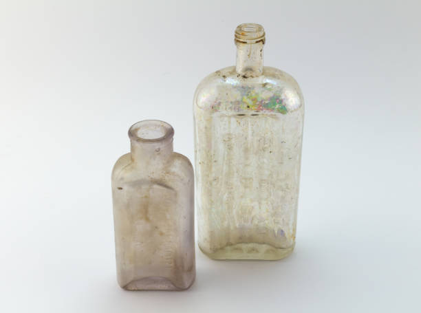 istock Old medicine bottles on white background 695123560