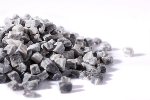 istock beautiful natural gray stones scattered on a white background 695126802