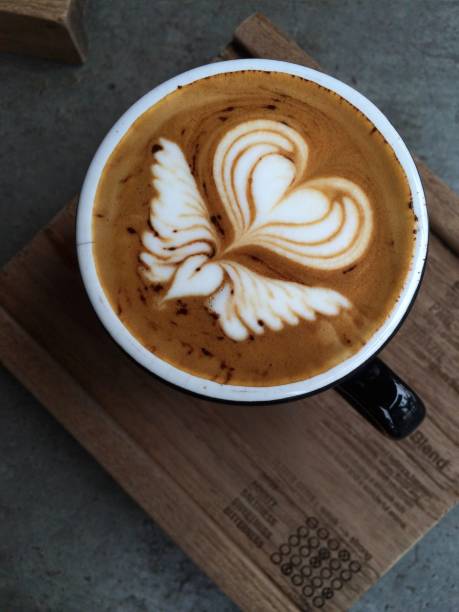 istock Nice Texture of Latte art on hot latte coffee 695130372