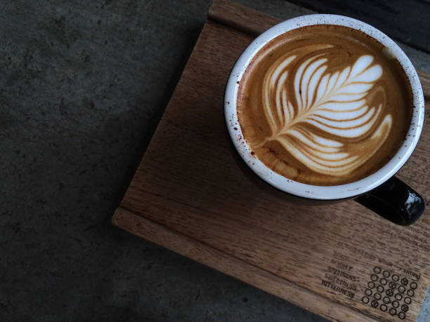 istock Nice Texture of Latte art on hot latte coffee 695130376