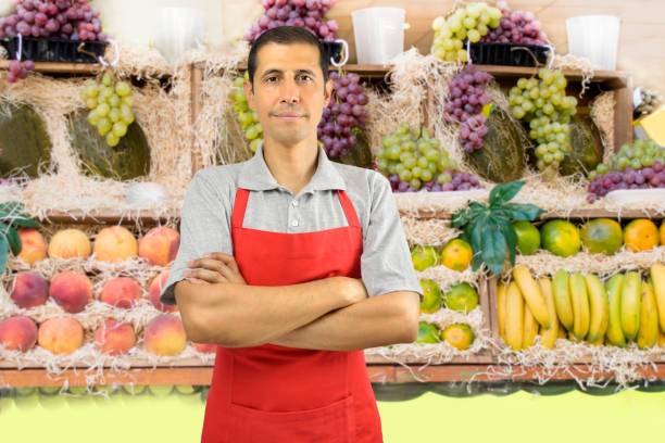 istock shopman at the greengrocer 695131218