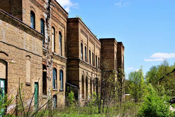 istock Abandoned Brick Industrial Building in Spring 695131552