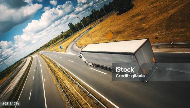 Heavy Cargo On The Road Stock Photo - Download Image Now - Truck, Semi-Truck, Rear View