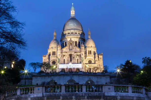Evening view of Basilica Sacre Coeur in Montmartre in Paris, France