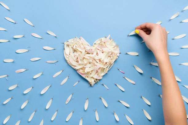 istock Handmade floral heart for Valentine's day on blue 695140812