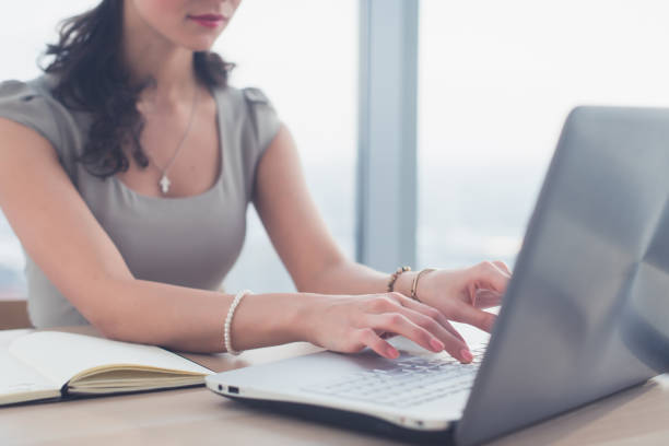 Side view photo of a female blogger, posting information in social network, using laptop, teleworking. Side view photo of a female blogger, posting information in social network, using laptop, teleworking cd writer photos stock pictures, royalty-free photos & images