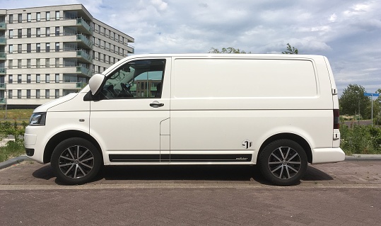 Almere Poort, Flevoland, The Netherlands - June 11, 2017: White Volkswagen Transporter sport parked on a public parking lot in the city of Almere. Nobody in the vehicle.