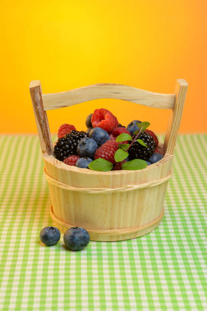 istock Wooden basket with berries 695155394