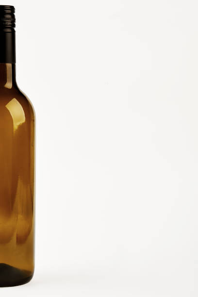 istock Half of dark bottle isolated. 695155442
