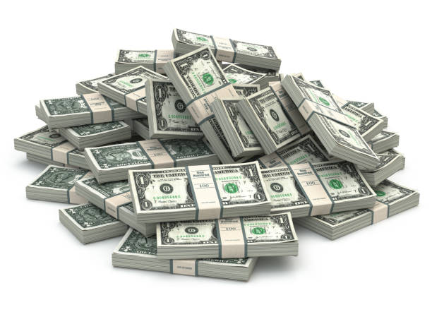 istock Dollar packs of banknotes heap isolated on white. 695158084