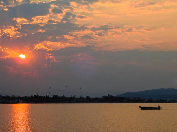 istock The sun rising on the lake. 695159882